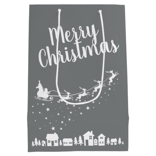 家の上のサンタのそり飛んでいるとトナカイ ミディアムペーパーバッグ (裏面)