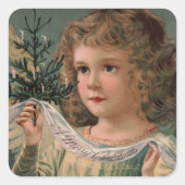 小さなキャンドルライトのクリスマスツリーを持つ天使 スクエアシール (正面)