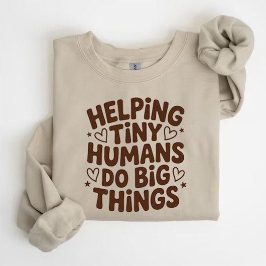 小さな人たちを支えて大きな偉業を成し遂げる Tシャツ