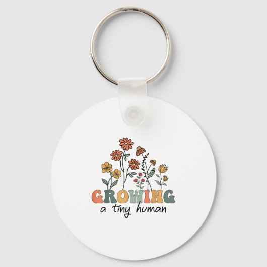 小さな人間を育てる 花柄の花 フラワーTシャツ 面白い 妊娠 キーホルダー (正面)