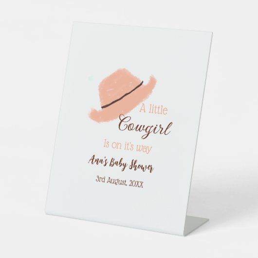 小さな女性のカーボーイがオレンジ色の赤ちゃんシャワーの上にある 台座サイン (正面)