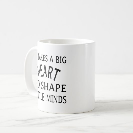 小さな心を形成するには大きなハートが必要である コーヒーマグカップ (正面左)