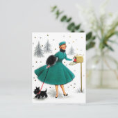 小さな犬と一緒の女性へのクリスマスプレゼント ポストカード (スタンド正面)