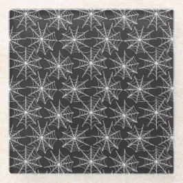 小さな白いハロウィーンのクモの巣が並ぶ黒 ガラスコースター