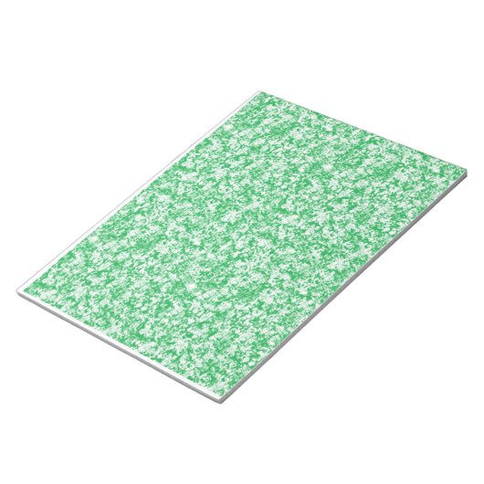 小さな白い点を持つ緑と白の背景 ノートパッド (アングル)