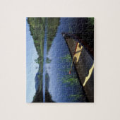 小さな長い池の岸にカヌーが止まる ジグソーパズル (縦)