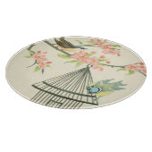 小さな鳥が枝に止まり鳥籠に止まる カッティングボード (角)