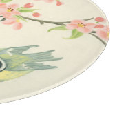 小さな鳥が枝に止まり鳥籠に止まる カッティングボード (角)