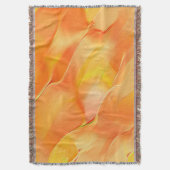 少し黄色と多くのオレンジで彫られた スローブランケット (正面縦)
