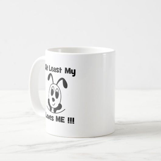 少なくとも私の犬は私を愛している コーヒーマグカップ (正面左)