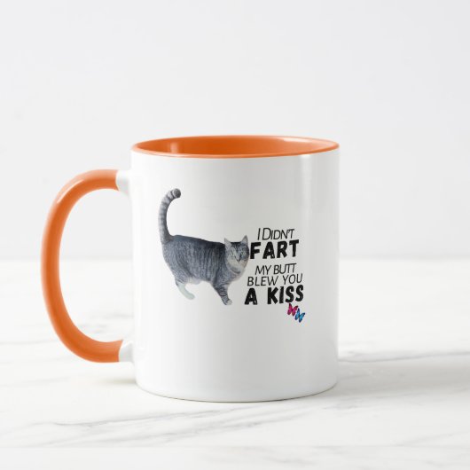 屁をこいたんじゃないよ、キスだよ - おもしろマグカップ マグカップ (左)