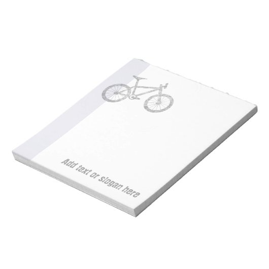 山のバイクもしくは自転車に乗る人ロゴとスローガン ノートパッド (回転)