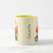 山積みの本とティーカップベア マグカップ (中央)