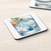 岩の上の水色のウォッカ コースター (左側)