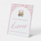 市場を離れて、何人のキスがサインするか推測する 台座サイン (正面)