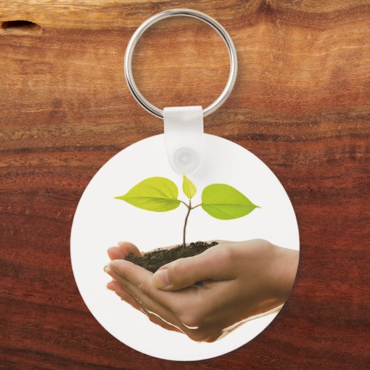 希望の変化になる – 手の中の苗木鍵 キーホルダー (正面)