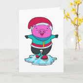 帽子とアイススケートで氷の上で遊ぶ豚 カード (黄色い花)