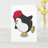 帽子をかぶったペンギンのアイススケート カード (黄色い花)