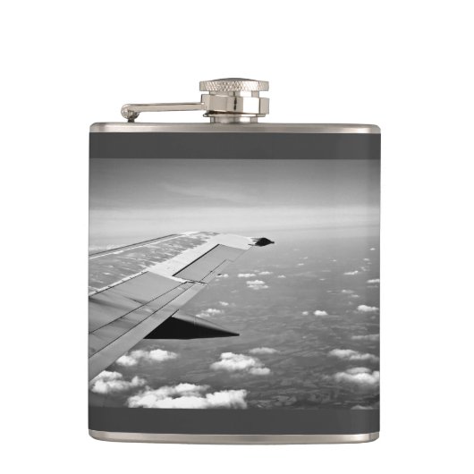 平らなテーマによってはのグレースケールの飛行機飛行が飛びます フラスク (正面)