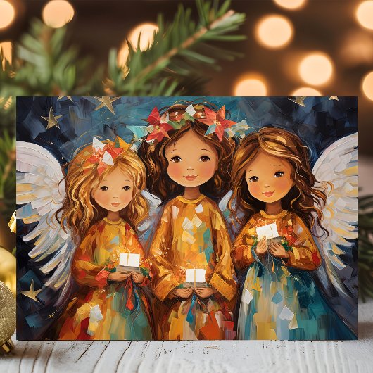 幻想的なクリスマスの天使たちろうそくを手に シーズンカード