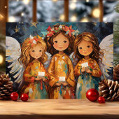 幻想的なクリスマスの天使たちろうそくを手に シーズンカード