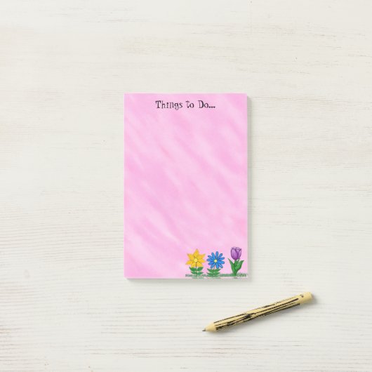 庭の花はピンクのポストそれをメモのパッドをする ポストイット (デスク上)