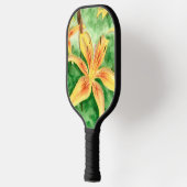 庭の黄色のユリ ピックルボールラケット (左)