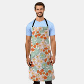 庭園花：ピンク、オレンジのシームレス エプロン (着用した状態)