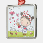 庭場面のてんとう虫を持つかわいい漫画の女の子 メタルオーナメント (左)