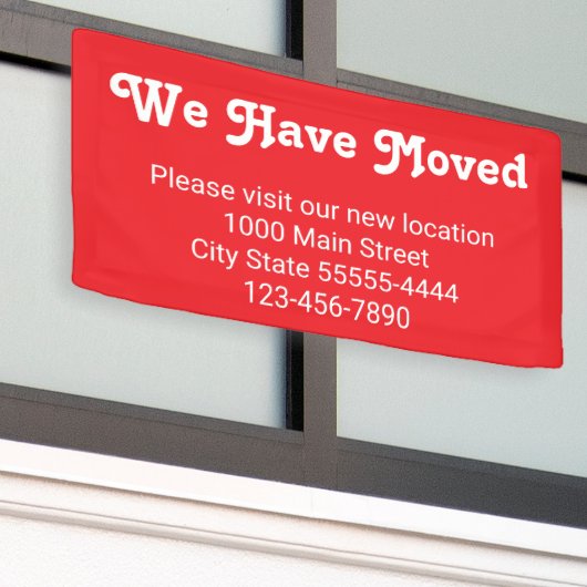 引越しのお越し先は赤 横断幕 (ビルの外側)