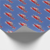 彼のオートバイに乗っている堅い見るサンタクロース ラッピングペーパー (角)