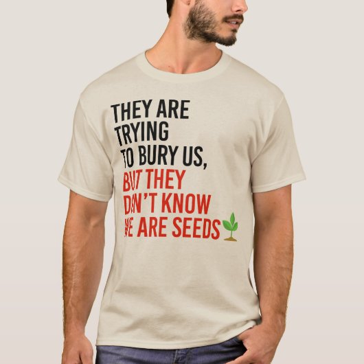 彼らは私たちを埋葬しようとしているが、私たちは種である Tシャツ (正面)