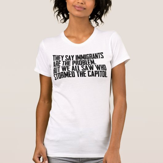 彼らは移民が問題だと言いますが、私たち全員が目撃したのは Tシャツ (正面)