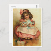 彼女の人形とクリスマスプレゼントとの小さな女の子 ポストカード (正面/裏面)