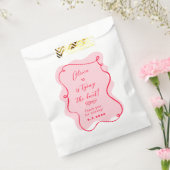 彼女はレトロなピンクと赤の結び目を結ん感謝していだ フェイバーバッグ (封をした状態)