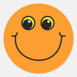 微笑のオレンジEmojiは直面します ラウンドシール