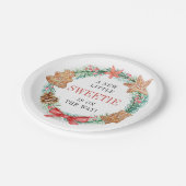 恋人がクッキーのクリスマスベビーシャワーを途中にある ペーパープレート (アングル)