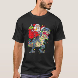 恐竜に乗ったサンタのクリスマスツリーTレックスドリンク Tシャツ
