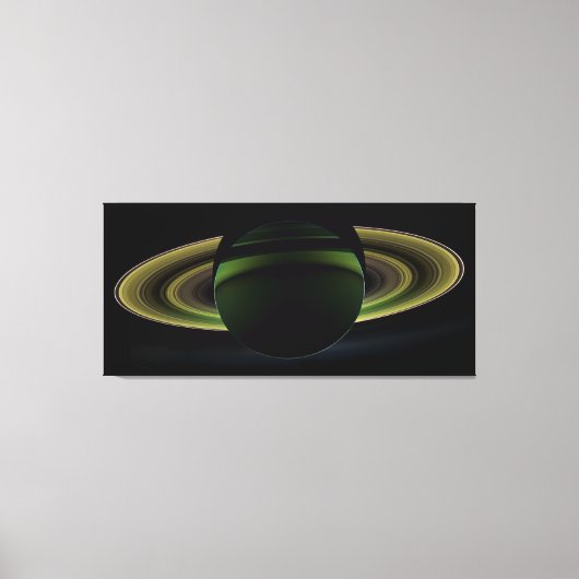 惑星輝く土星の後ろの太陽が影を投げる キャンバスプリント (正面)