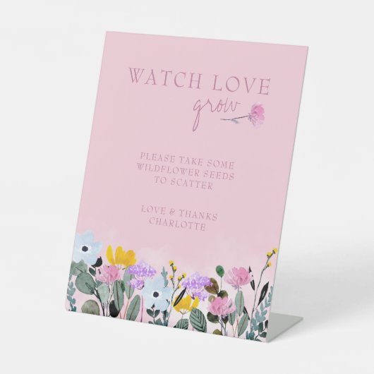 愛が花の種の恩恵を育てるのを見る 台座サイン (正面)