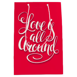 愛はすべてのスクリプトのまわりにレタリングピンク ミディアムペーパーバッグ