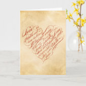 愛は忍耐強い... 赤いカリグラフィーのハート カード (黄色い花)