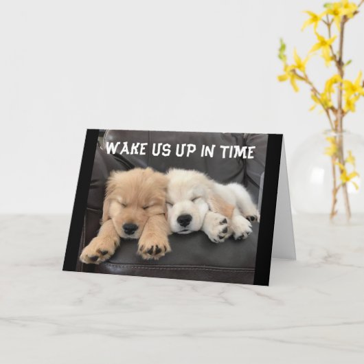 愛らしい昼寝の子犬が「聖降誕祭お目出度う」と願う カード (黄色い花)