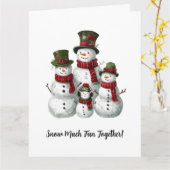 愛らしい雪だるまファミリーがお揃いの帽子とマフラーで カード (黄色い花)