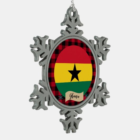 愛国的なガーナ、赤いバッファローのプレイド、ガーナ国旗 スノーフレークピューターオーナメント (左)