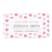 愛手製の缶詰になる瓶によってなされるピンクのハート