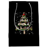 懐中電灯で覆われたウサギのクリスマスツリー ミディアムペーパーバッグ (正面)