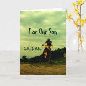 『我が息子の誕生日バイクもしくは自転車に乗る人のジャンプ』 カード (黄色い花)