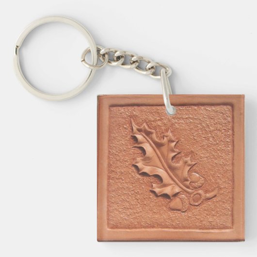 手によって用具を使われる革カシの葉のアクリルKeychain キーホルダー (正面)