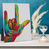 手のひらを相手に向けて、親指と人差し指と小指を立て、残りの指は握り込む。 フォトプラーク (側面)